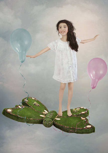 istock Little girl in the clouds 515849310