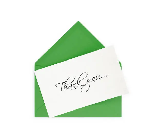 Green  envelope and thank you note. Isolated on white background. Clipping path is included.