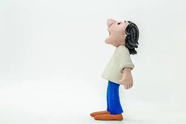 Photo of handmade clay figurine: man with surprise expression