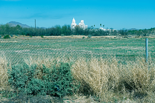 Baseball field and San Xavier del Bac mission on Tohono O'odham Indian reservation near Tucson Arizona USA