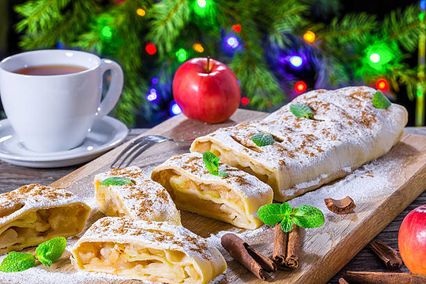 istock homemade apple strudel with powdered sugar and mint leaves. 515853092