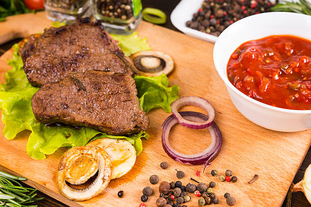 istock Cooked Pieces of Beef with Salsa and Seasonings 515854718