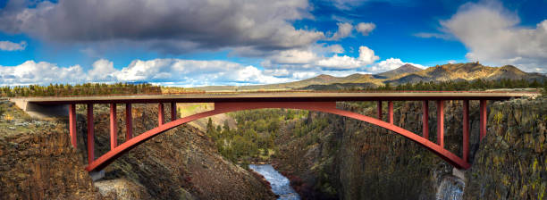 istock Red  highway  bridge across ravine in high desert panorama 515855120
