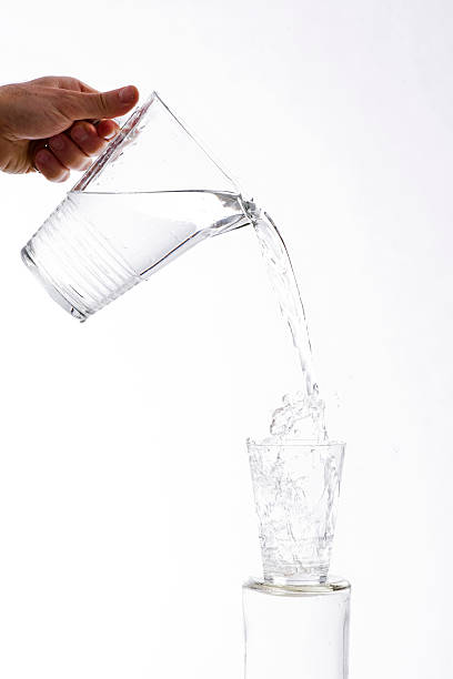 istock Poured water from a jug into a glass 515855192