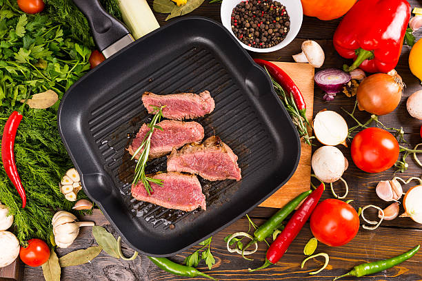 istock Rare Beef Slices in Pan Surrounded by Ingredients 515855918