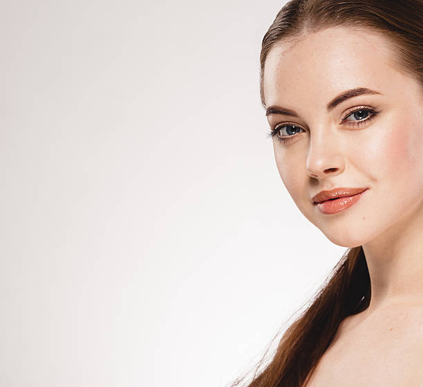 istock Beautiful woman face close up portrait studio on white 515856128
