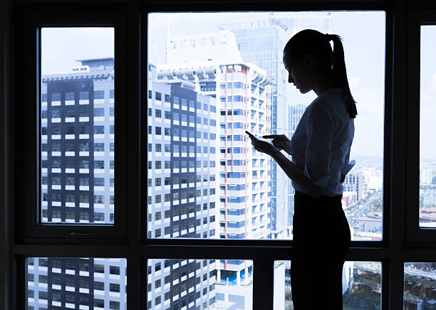 istock Woman using mobile smart phone in the office 515859852