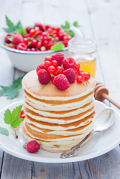 istock Pancakes with red berries and honey 515860054