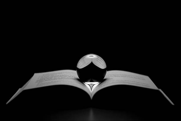 istock Book and glass ball 515860524