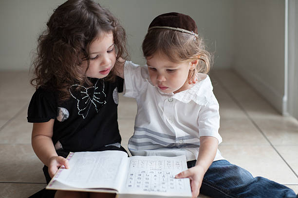 Kids learning Aleph Bet Brother and sister studying the Aleph Bet together yarmulke photos stock pictures, royalty-free photos & images