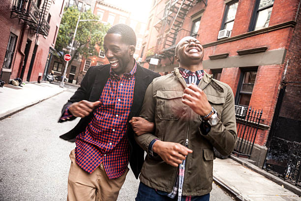 coppia a piedi nel greenwich village, new york - homosexual homosexual couple black ethnic foto e immagini stock