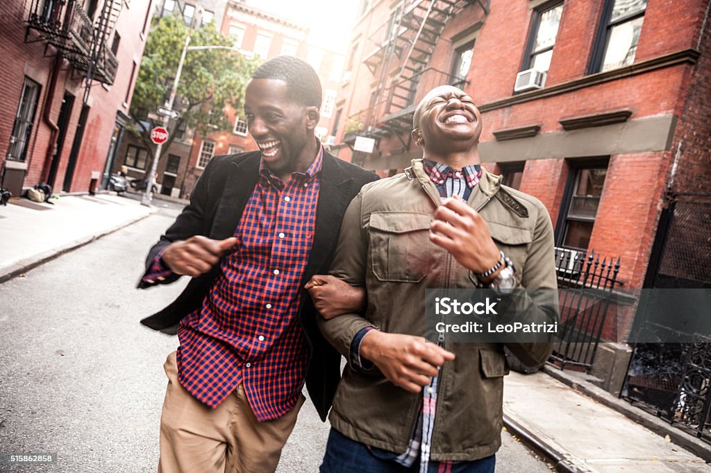 Couple walking in Greenwich Village - NY Homosexual young couple hanging out and walking in Greenwich Village - New York, USA. Friendship Stock Photo