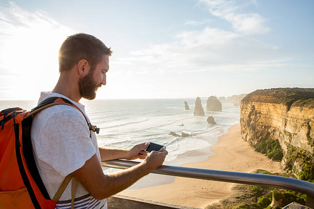 istock Tourist at the Twelve Apostles using mobile phone 515863056