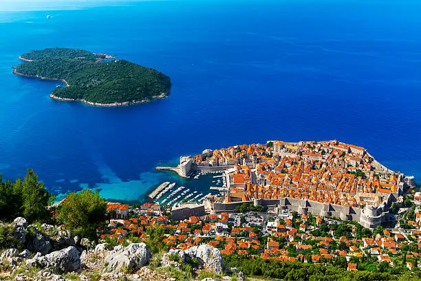 Croatia. South Dalmatia. Aerial view of Dubrovnik, medieval walled city (it is on UNESCO World Heritage List since 1979) and Lokrum Island (nature reserve)