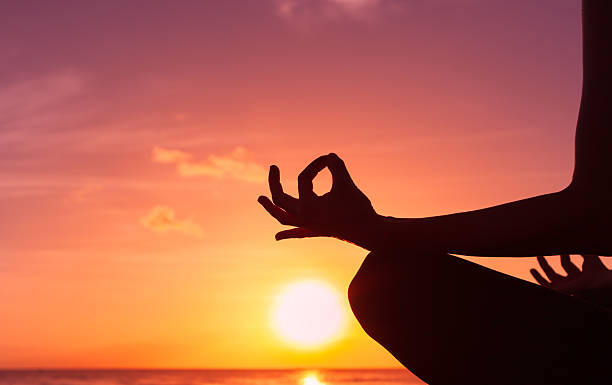 istock Woman meditating in lotus position 515863538