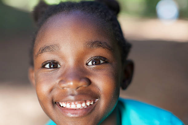 istock Young african girl smiling at the camera 515864219