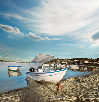 Toutristic motor boat by the shore in Ormos Panagias, Sithonia, Northern Greece