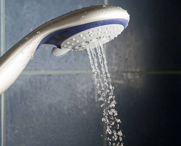 istock Shower head with stream of water spead out 515864546