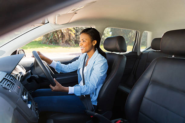 istock african woman driving a car 515864947