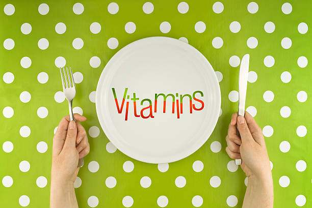istock Woman eating vitamins, top view 515866015