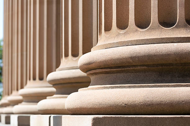 istock Closeup row of classical stone columns, copy space 515882030