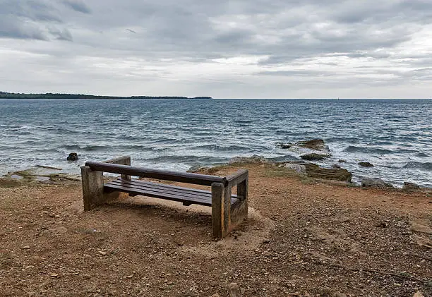 Adriatic seascape with empty bench in Istria, Croatia