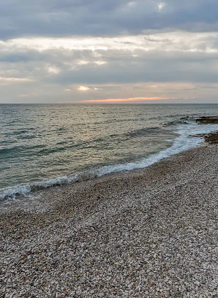 Sunset pebble beach on Adriatic Sea in Istria, Croatia