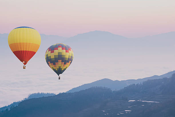 istock Hot air balloons flying over the mountain. 515883262