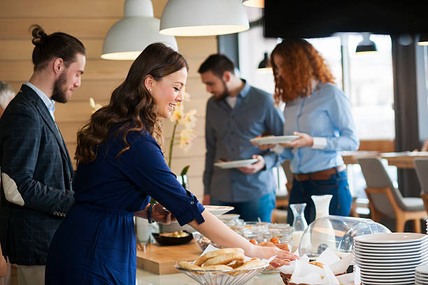 Business people at lunch Banquet lunch break at conference meeting, people choosing food buffet stock pictures, royalty-free photos & images