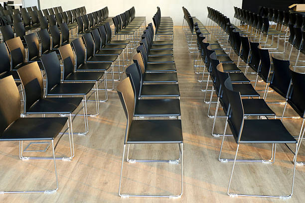 istock Interior of empty conference hall with gray colored chairs 515885864