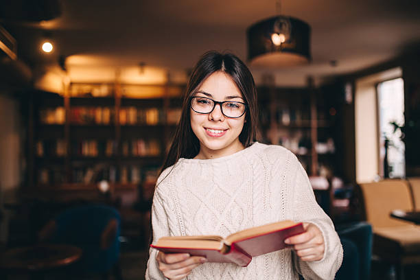 istock Portrait of a beautiful student in library 515885908