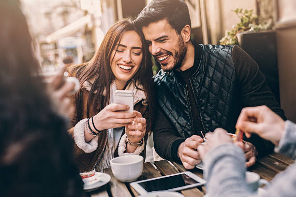 istock Two couples having fun in cafe outdoors 515889230