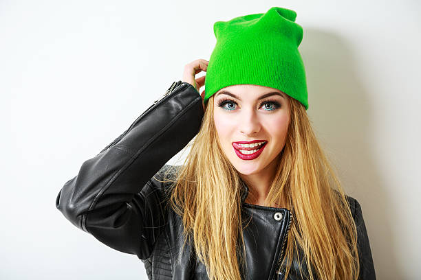 Hipster Girl in Green Beanie Hat on White stock photo