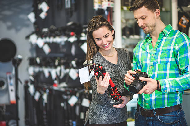 istock Young couple choosing photographic equipment 515889620