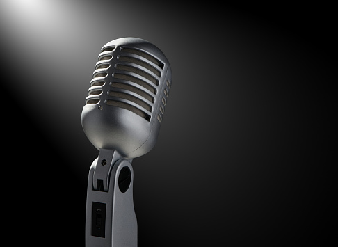 Vintage microphone on black with highlights