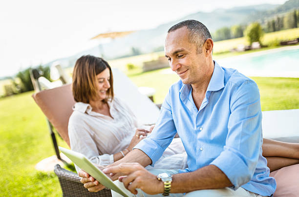 istock happiness mature couple embracing and surfing 515890132
