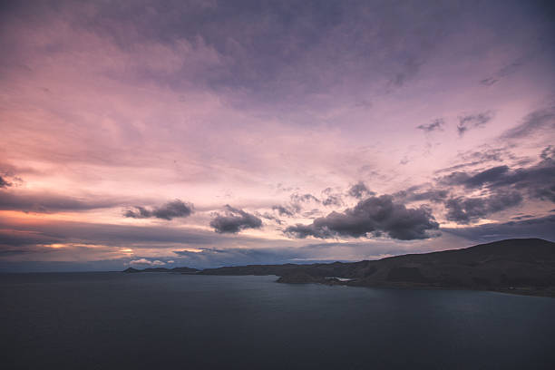 istock Sunset at lago titicaca with pink sky 515891476