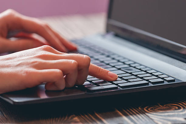 istock woman typing on laptop 515891528