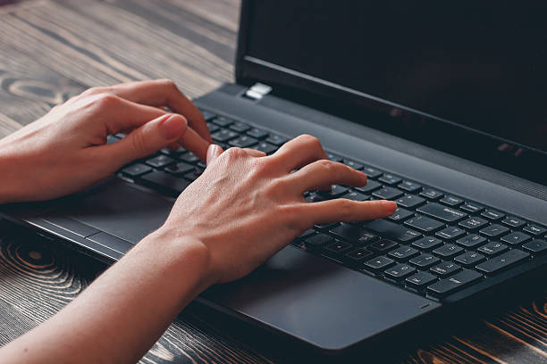 istock woman typing on laptop 515891644