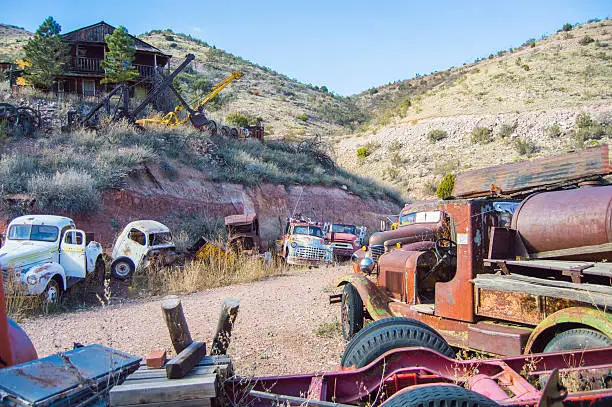 Abandoned old cars and trucks in a ghost town in Jerome, AZ