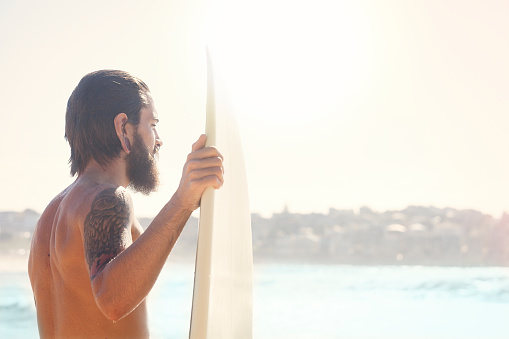 Surfer with his surf board at Bondi Beach, Sydney. Australia.