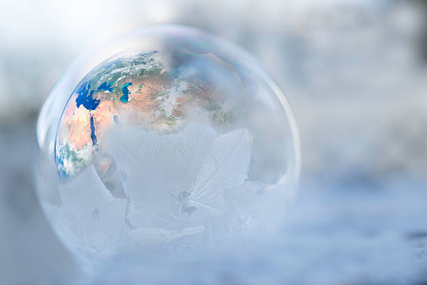 istock Earth inside a half frozen globe for showing weather change 515895916