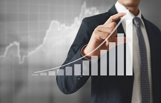 istock Businessman with financial symbols coming 515896586