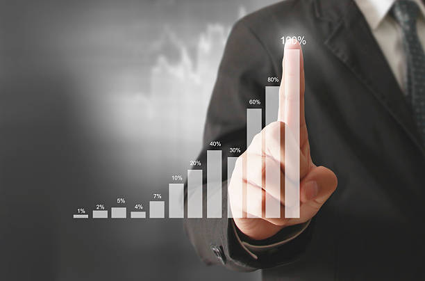 istock Businessman with financial symbols coming 515896772
