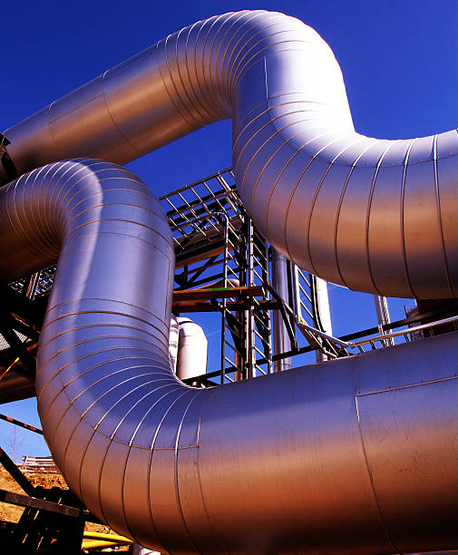 istock Industrial zone, Steel pipelines at sunset 515908815
