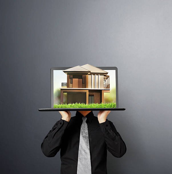 istock house on laptop human  hands 515910147