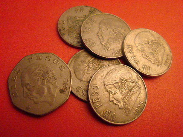 istock Older Mexican Peso Coins 515910729