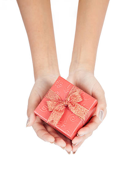 istock Top view of gift box with red ribbon in hand 515911079