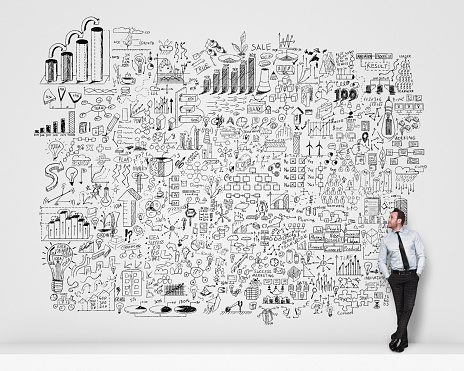 Businessman standing look at drawing business planning.