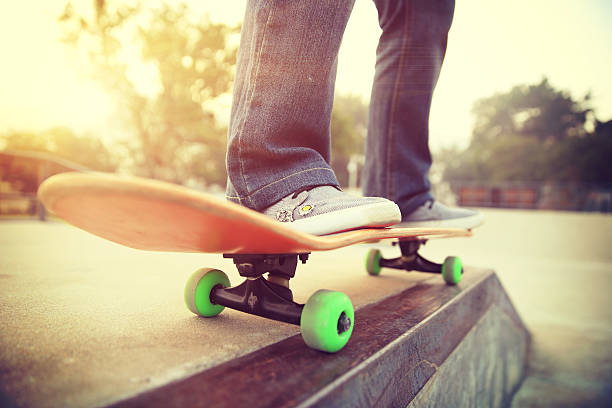 istock skateboarding legs at skatepark 515919280